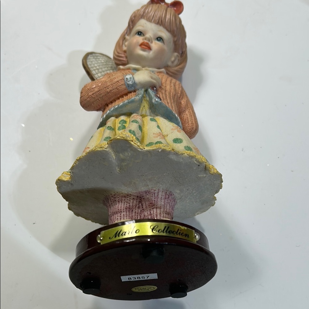 Charming Figurine with Orange Sweater